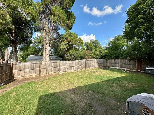 a view of a backyard with swings