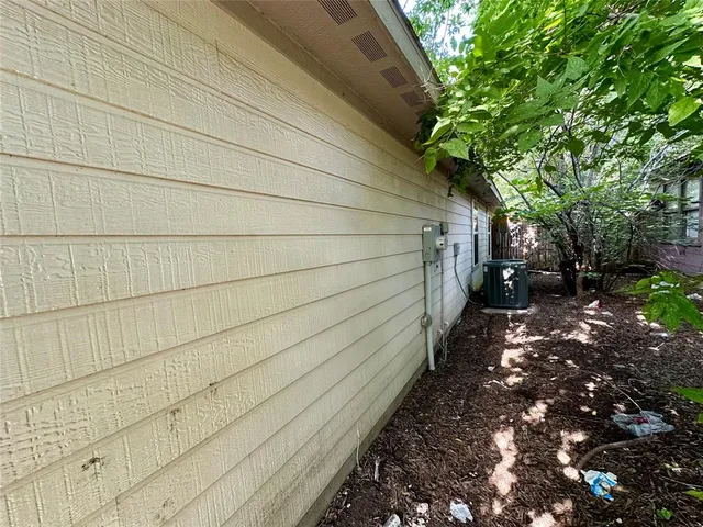 a pathway of a house with a trees