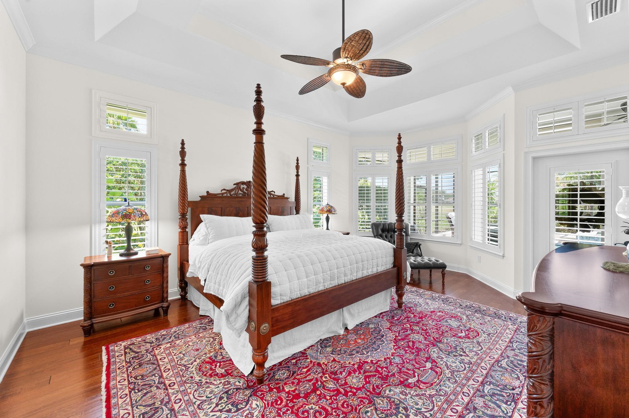 248 Marshside Drive St. Augustine, FL 32080 - Photo 19 of 78 a bedroom with a bed and wooden floor