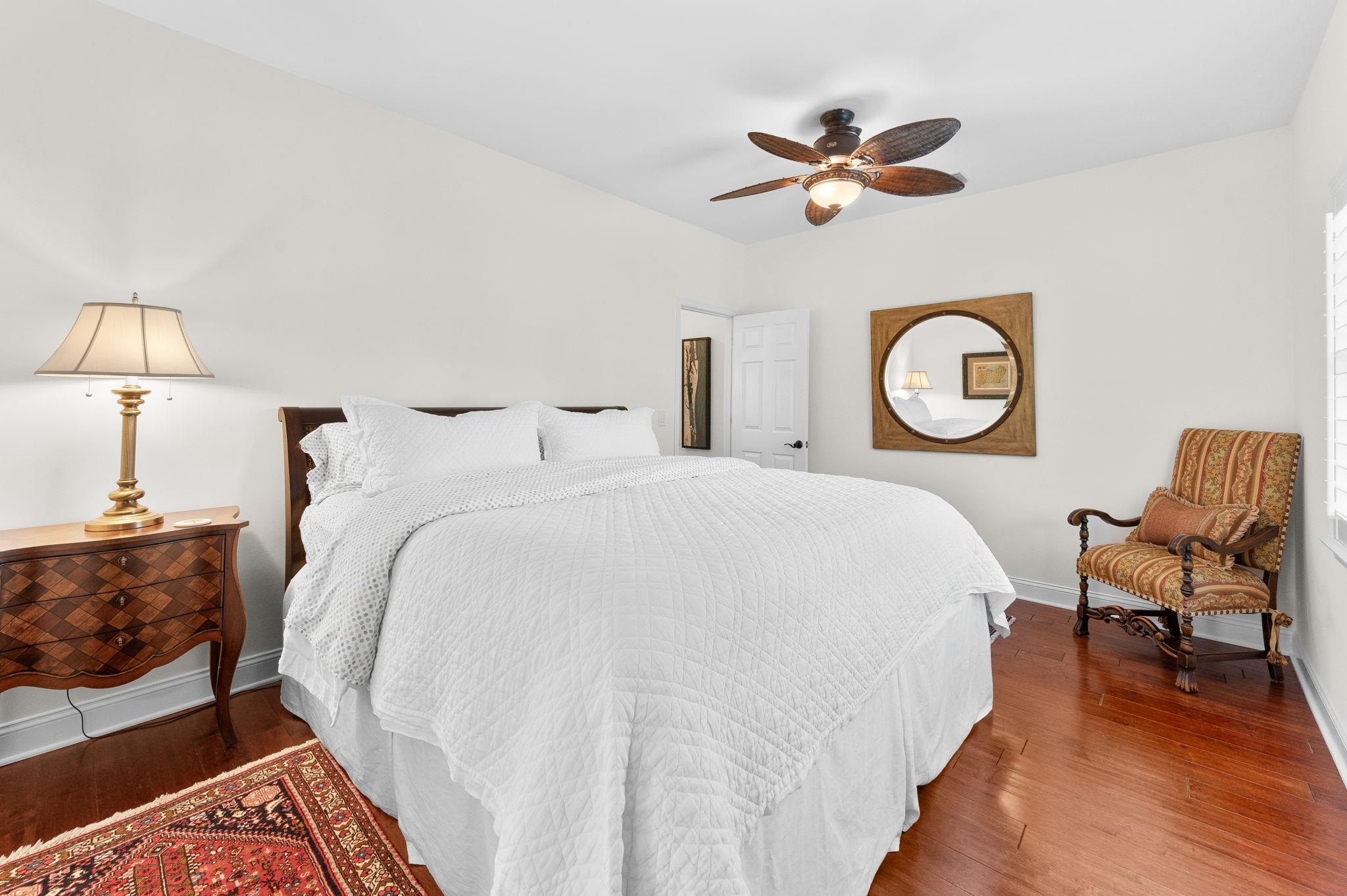 248 Marshside Drive St. Augustine, FL 32080 - Photo 27 of 78 a bed room with a bed and a chandelier