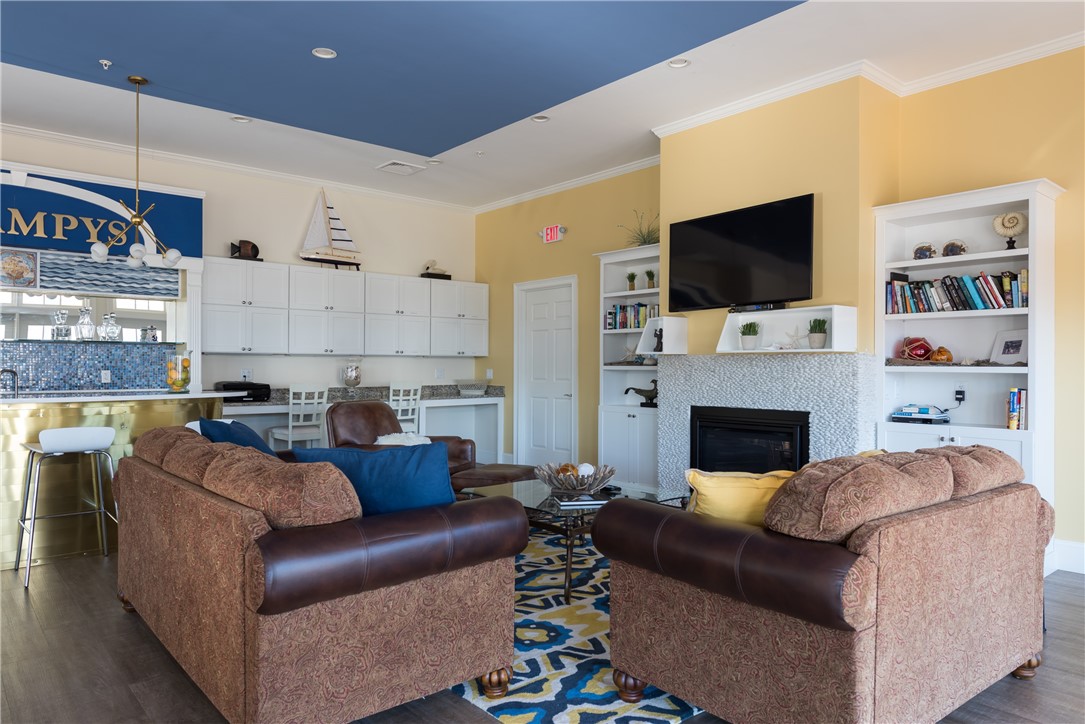 3 Compass Way, Unit B301 Westerly, RI 02891 - Photo 23 of 33 Clubhouse Living Room with a fireplace