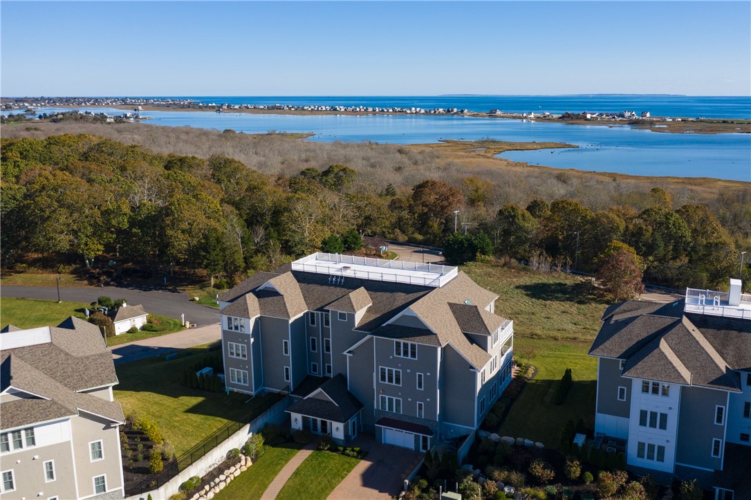 3 Compass Way, Unit B301 Westerly, RI 02891 - Photo 26 of 33 Aerial view of Penthouse building with Winnapaug Pond and the Atlantic Ocean in the distance.