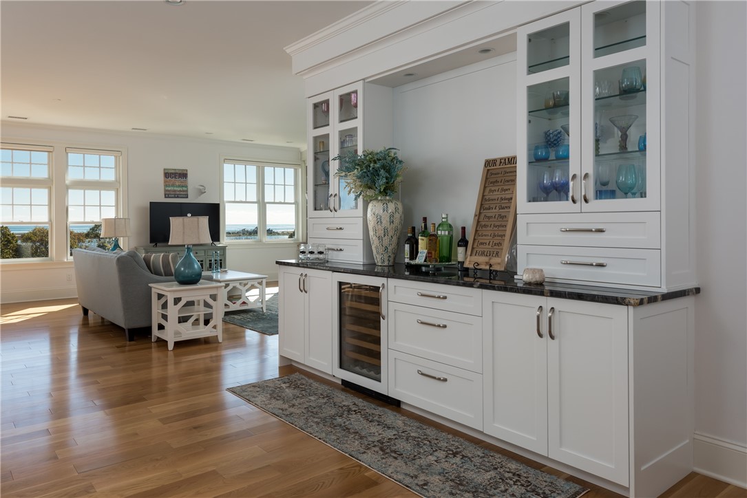 3 Compass Way, Unit B301 Westerly, RI 02891 - Photo 3 of 33 Entry to the Penthouse with a dry bar to the right and captivating ocean and pond views that will take your breath away.