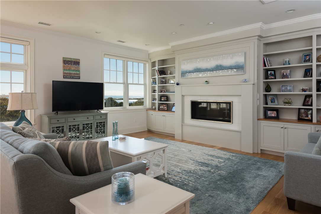 3 Compass Way, Unit B301 Westerly, RI 02891 - Photo 4 of 33 Living Room with gas fireplace and ocean views.