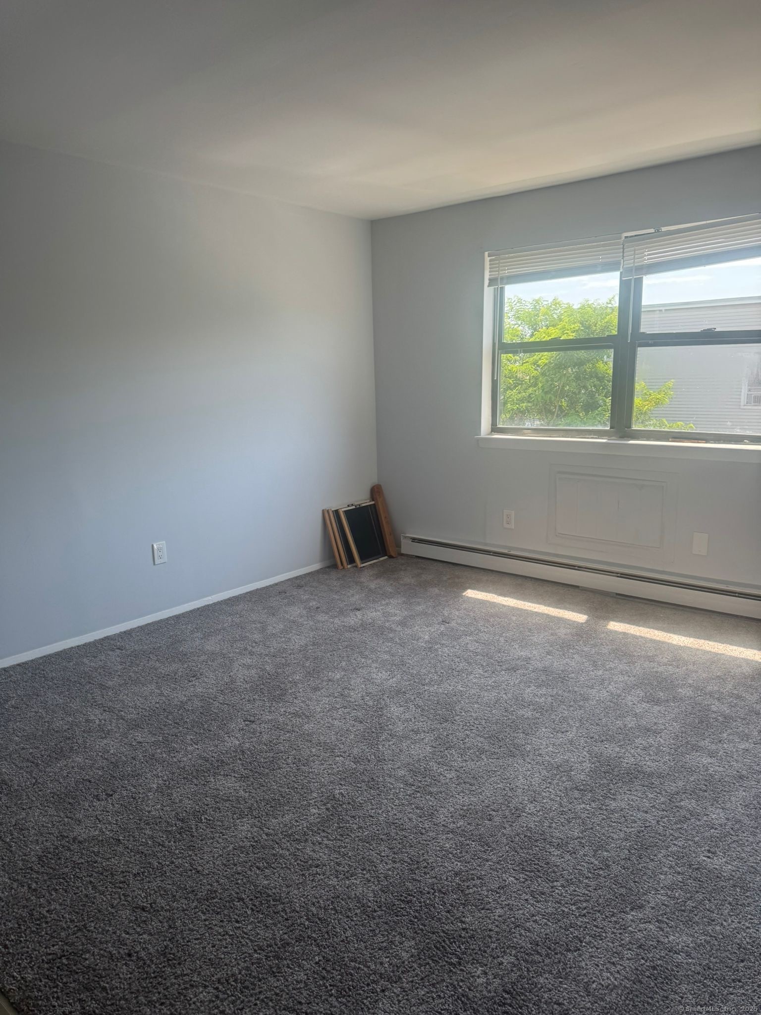 217 Hollister Avenue, Unit C3 Bridgeport, CT 06607 - Photo 4 of 7 an empty room with windows