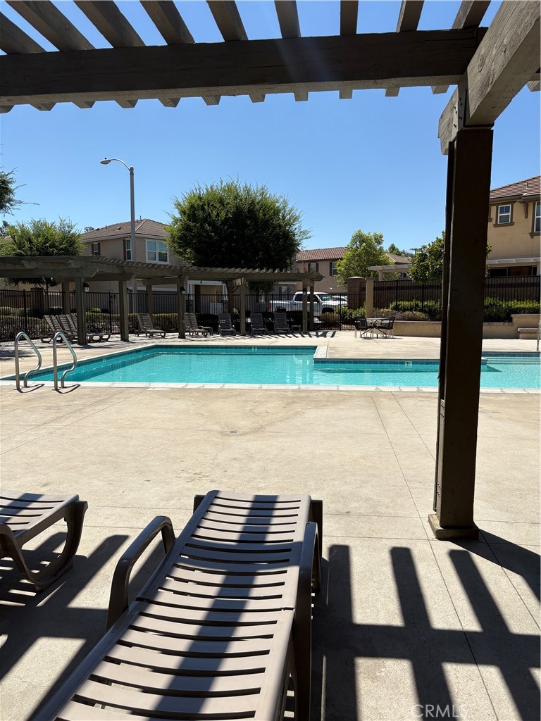28434 Sunflower Street Highland, CA 92346 - Photo 20 of 22 a view of a yard with wooden floor and lake view