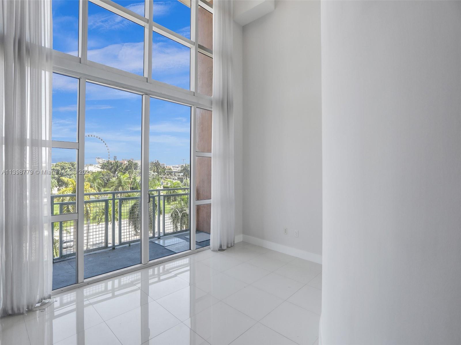 244 Biscayne Boulevard, Unit 439 Miami, FL 33132 - Photo 12 of 49 a view of a balcony with window