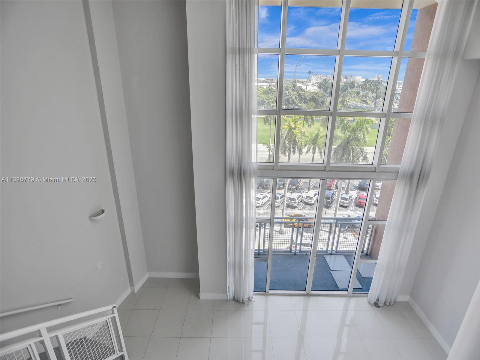 244 Biscayne Boulevard, Unit 439 Miami, FL 33132 - Photo 14 of 49 a view of an empty room with a window