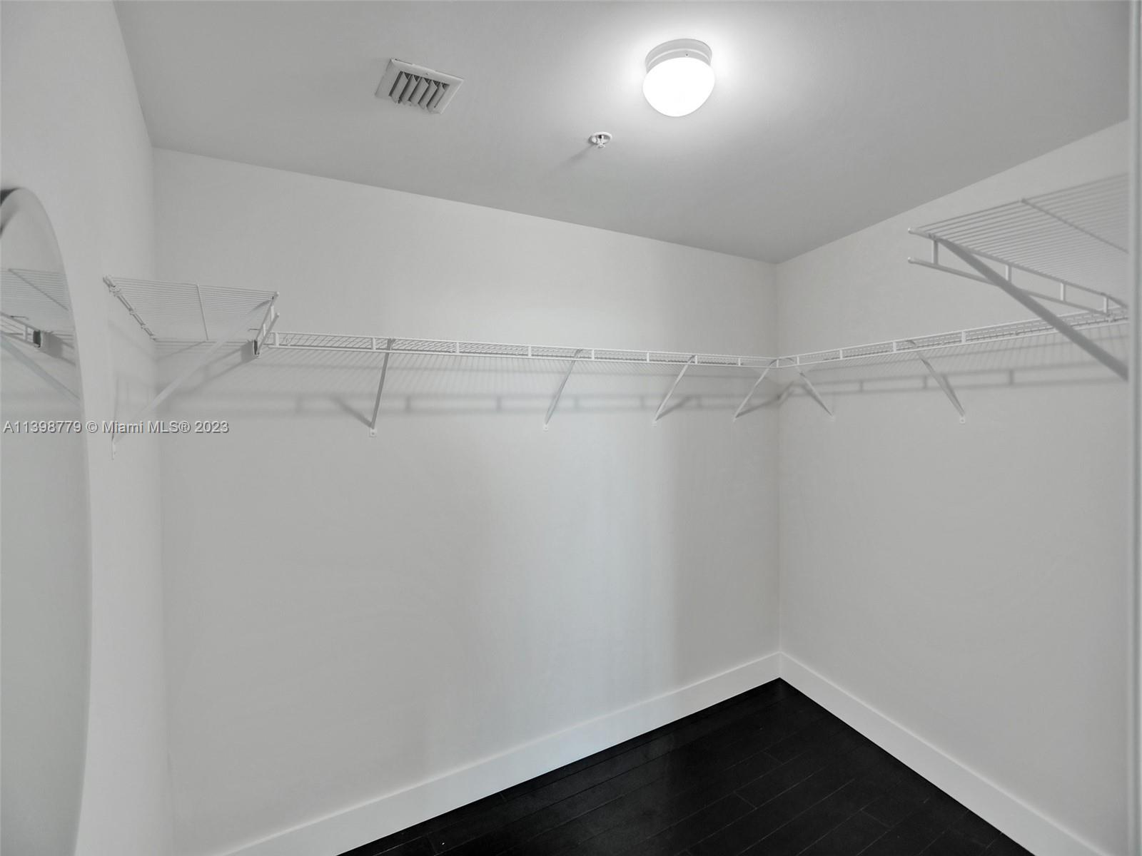 244 Biscayne Boulevard, Unit 439 Miami, FL 33132 - Photo 21 of 49 a view of a room with racks on the wall