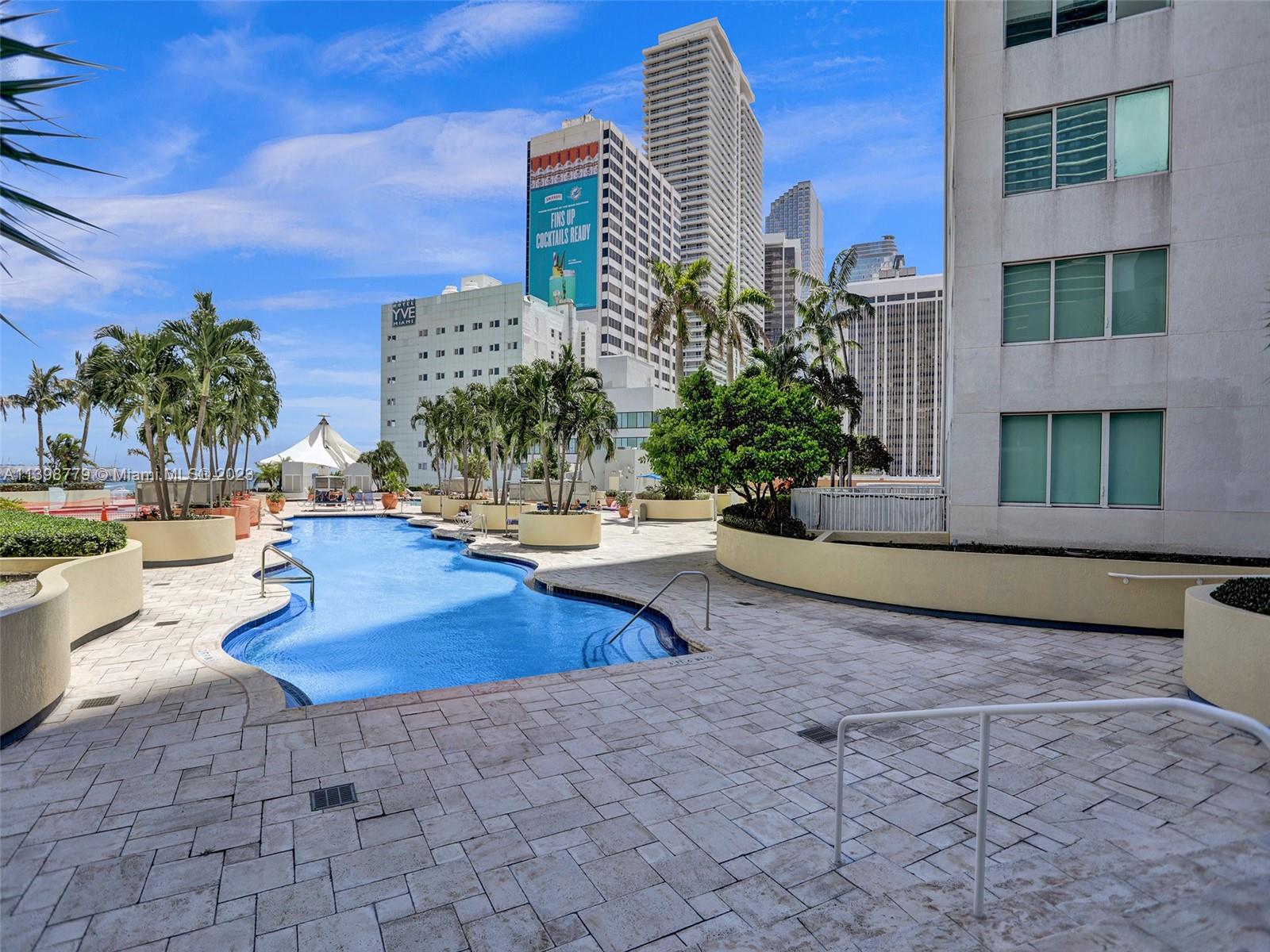 244 Biscayne Boulevard, Unit 439 Miami, FL 33132 - Photo 40 of 49 a view of a swimming pool with outdoor seating