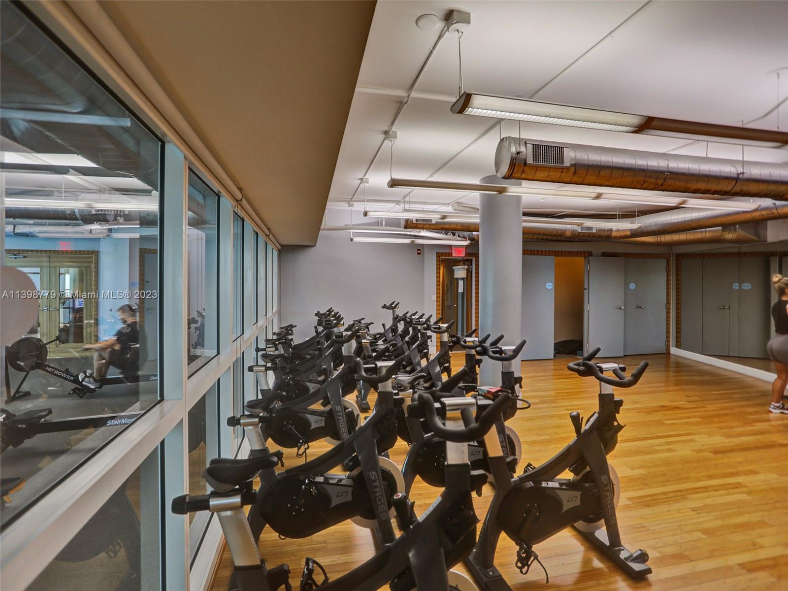 244 Biscayne Boulevard, Unit 439 Miami, FL 33132 - Photo 48 of 49 a view of a room with gym equipment