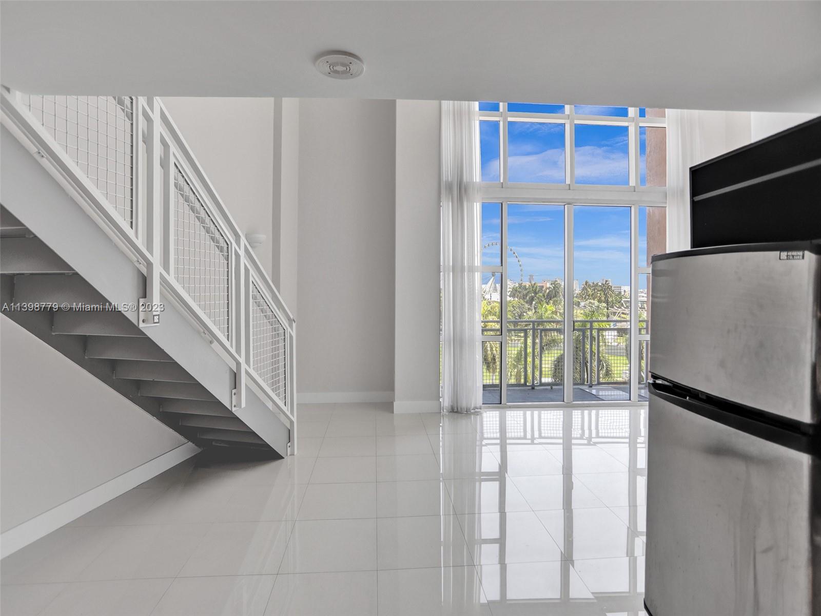 244 Biscayne Boulevard, Unit 439 Miami, FL 33132 - Photo 9 of 49 a view of entryway with wooden floor