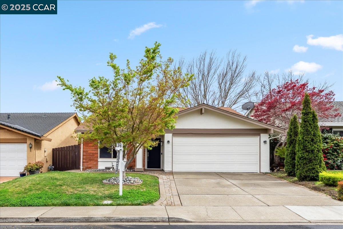 27 Palamos Court San Ramon, CA 94583 - Photo 1 of 1 a front view of a house with a yard and a garage