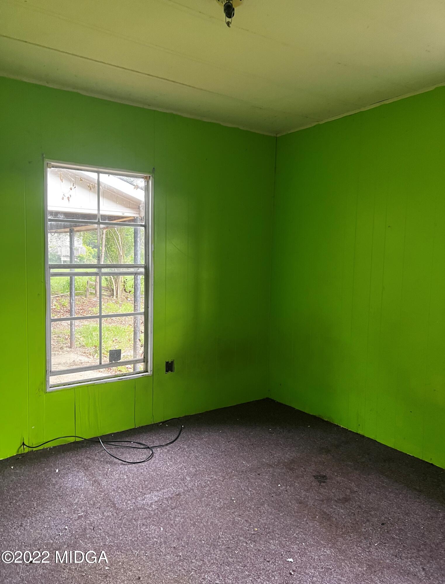 6509 Skipper Road Macon, GA 31216 - Photo 14 of 28 a view of a room with a window and a ceiling fan
