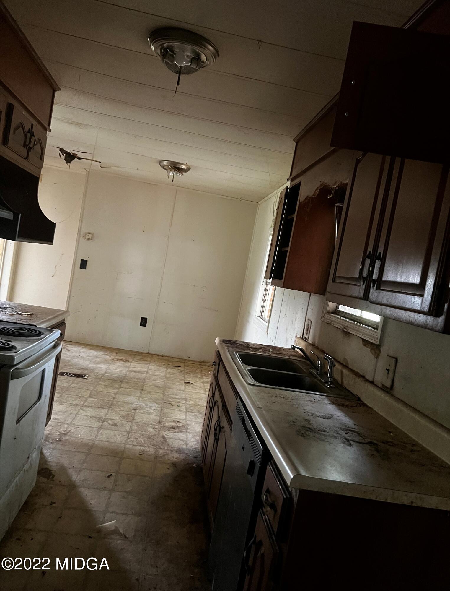 6509 Skipper Road Macon, GA 31216 - Photo 17 of 28 a kitchen that has a sink and a stove