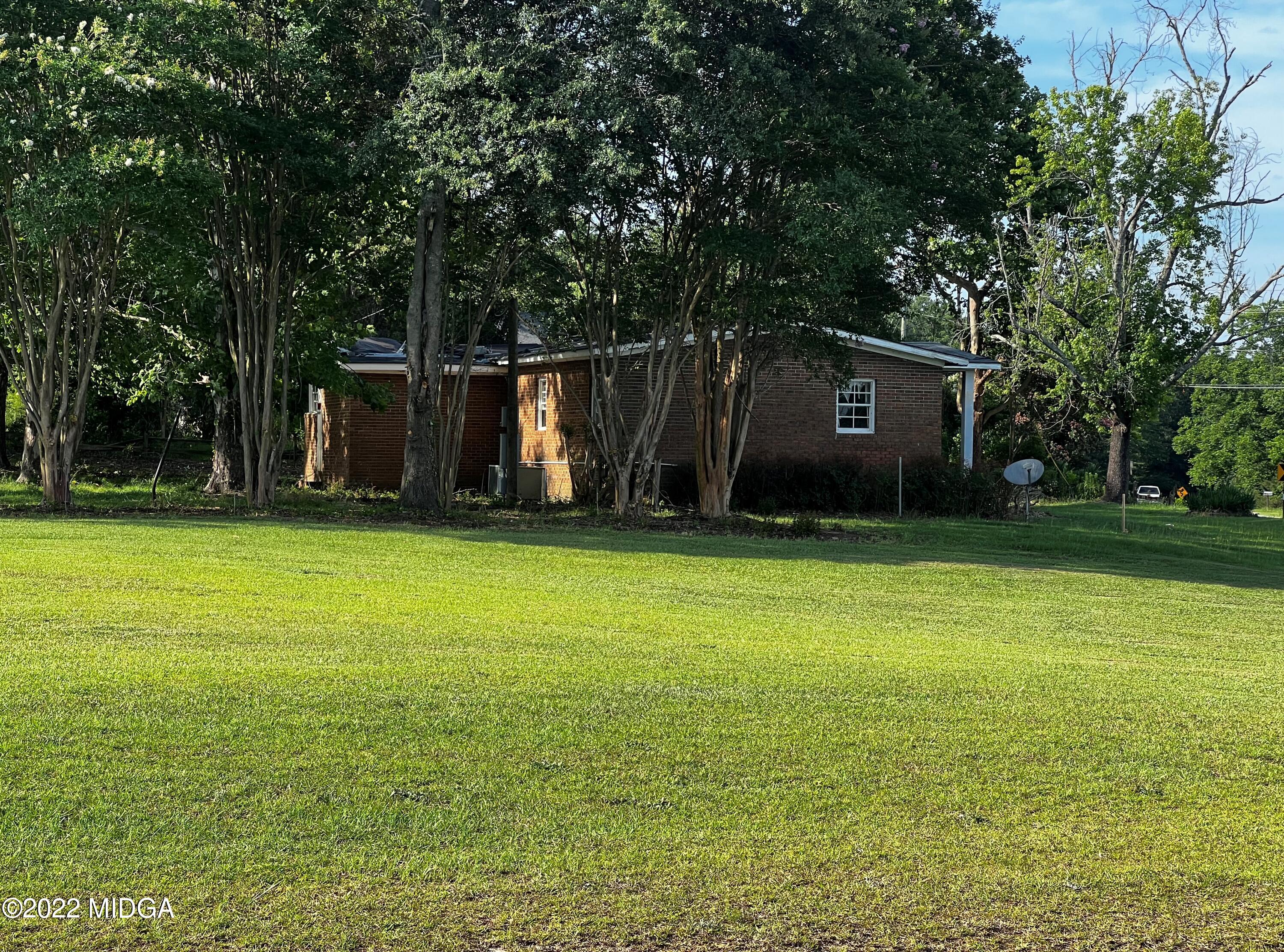 6509 Skipper Road Macon, GA 31216 - Photo 4 of 28 a front view of a house with a yard