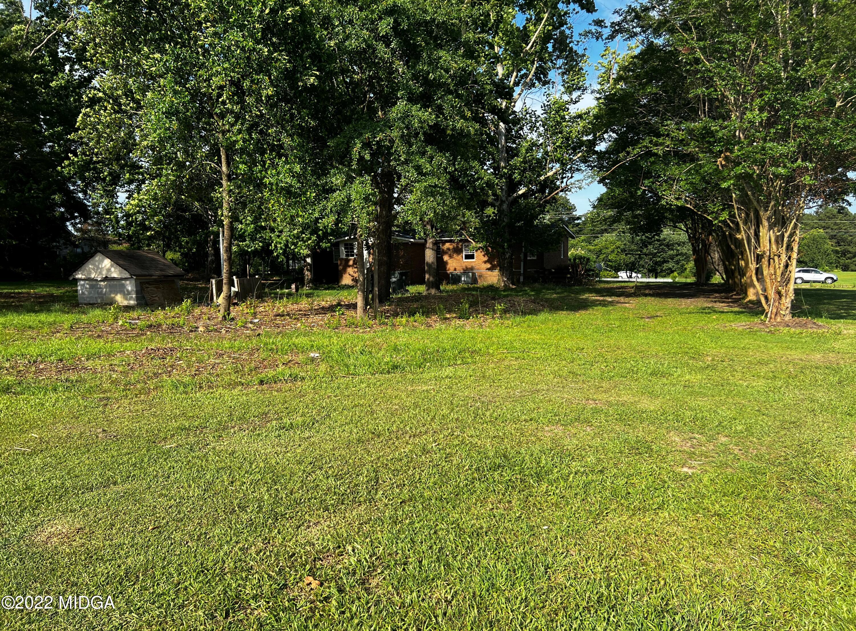 6509 Skipper Road Macon, GA 31216 - Photo 5 of 28 a backyard of a house with lots of green space