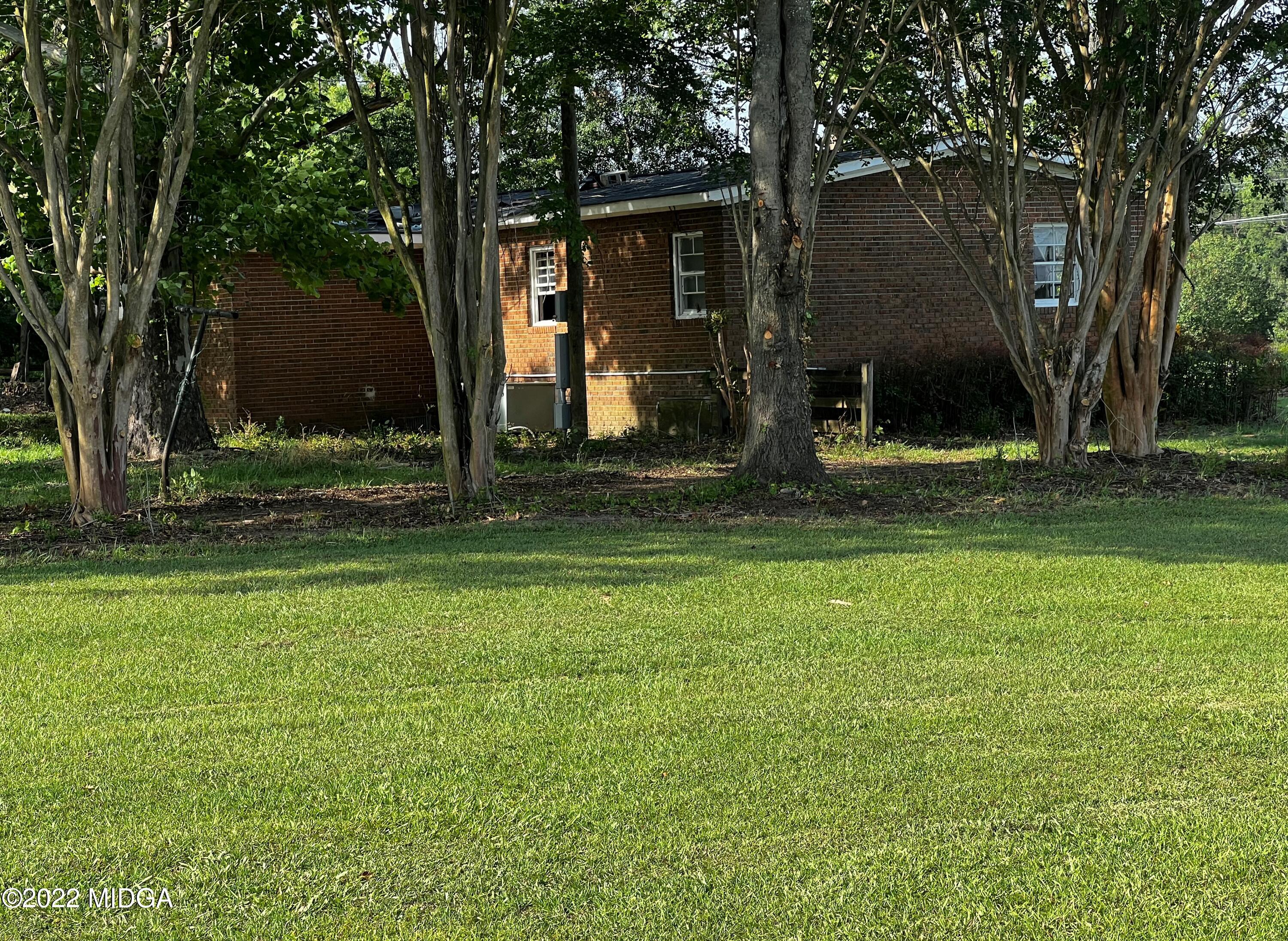 6509 Skipper Road Macon, GA 31216 - Photo 9 of 28 a view of a house with a yard