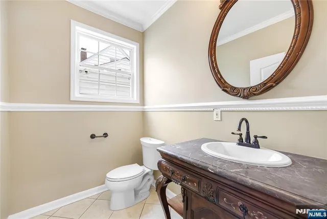 a bathroom with a sink a mirror and a toilet