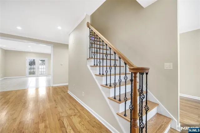 a view of an entryway with wooden floor