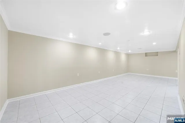 an empty room with white walls