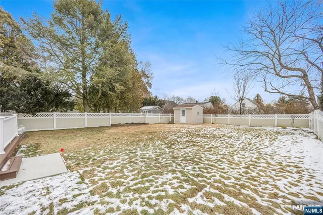 a view of a backyard of the house