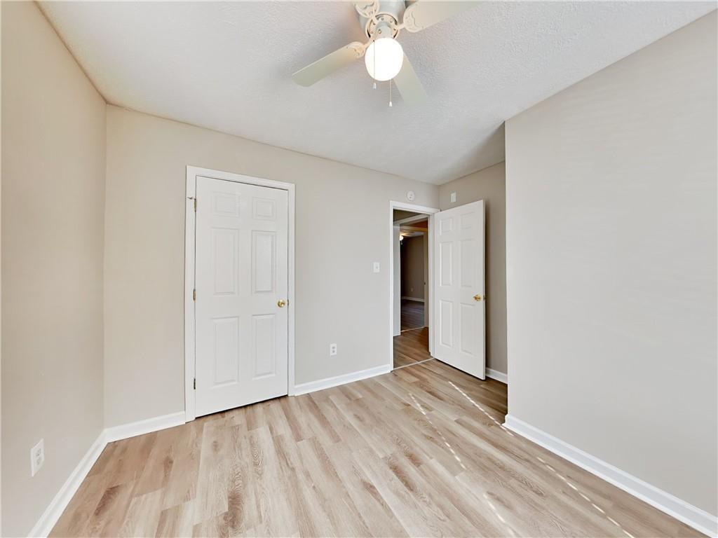 729 Cooper Street Southwest Atlanta, GA 30315 - Photo 16 of 20 a view of an empty room with wooden floor