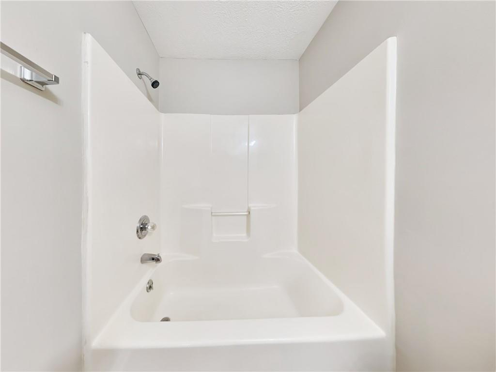 729 Cooper Street Southwest Atlanta, GA 30315 - Photo 17 of 20 a white bath tub sitting next to a white sink
