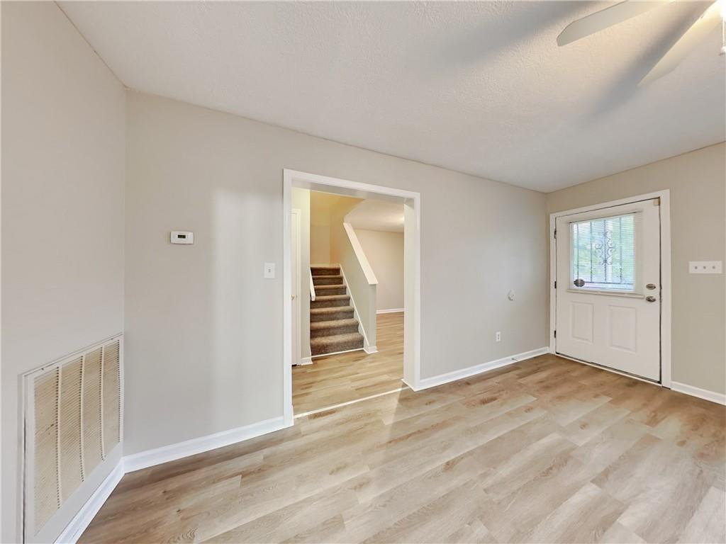 729 Cooper Street Southwest Atlanta, GA 30315 - Photo 2 of 20 an empty room with windows