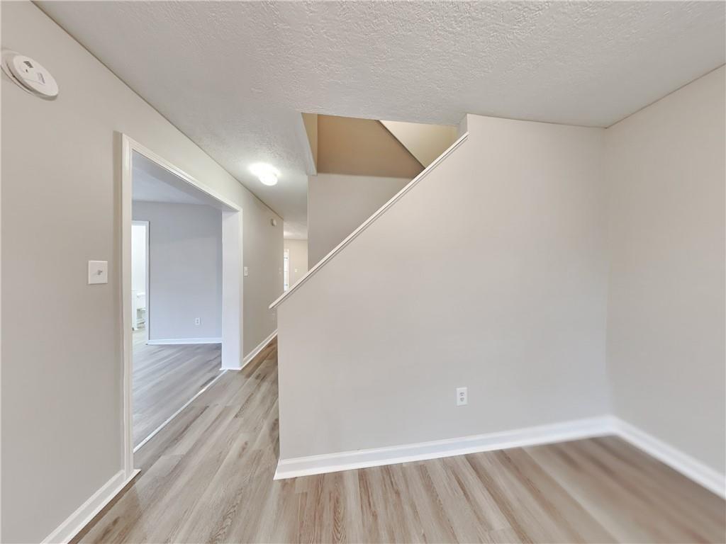 729 Cooper Street Southwest Atlanta, GA 30315 - Photo 8 of 20 a view of a hallway with staircase