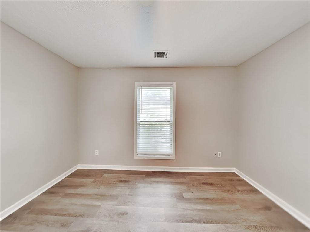 729 Cooper Street Southwest Atlanta, GA 30315 - Photo 10 of 20 a view of empty room with wooden floor and fan