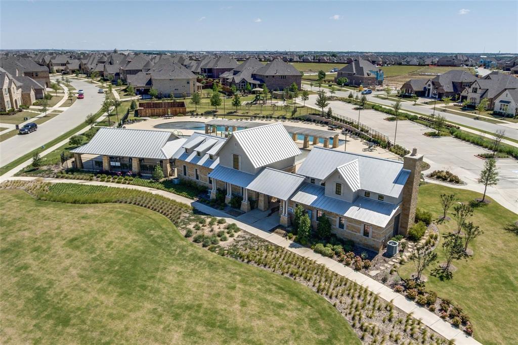 1518 Saddle Tree Road Frisco, TX 75036 - Photo 38 of 40 an aerial view of a house with a garden lake view