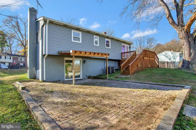 a view of a balcony with wooden floor and fence