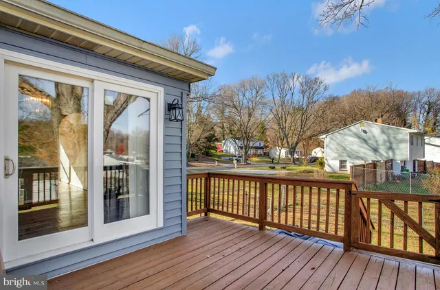 a view of wooden deck and a garden