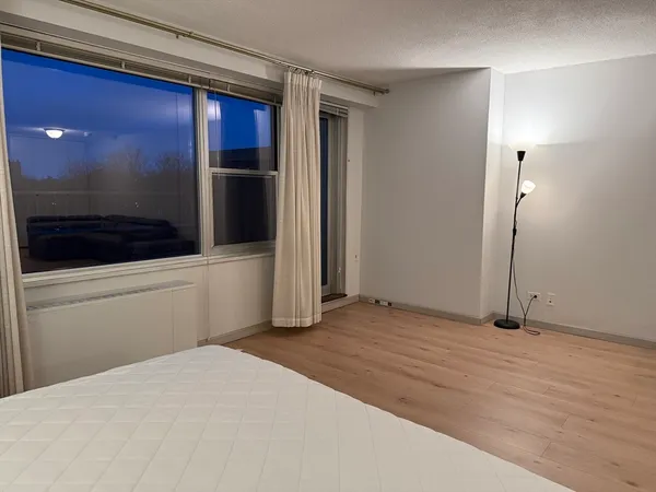 a view of empty room with a fireplace