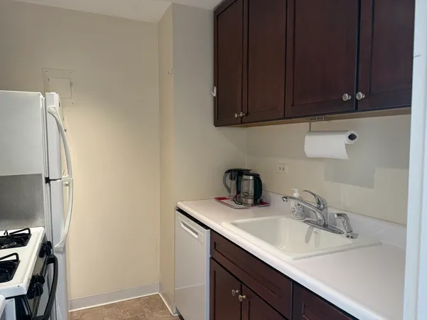 a close view of sink and cabinets