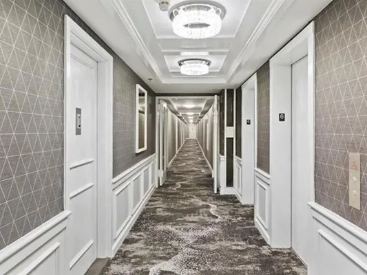 a view of a hallway with windows