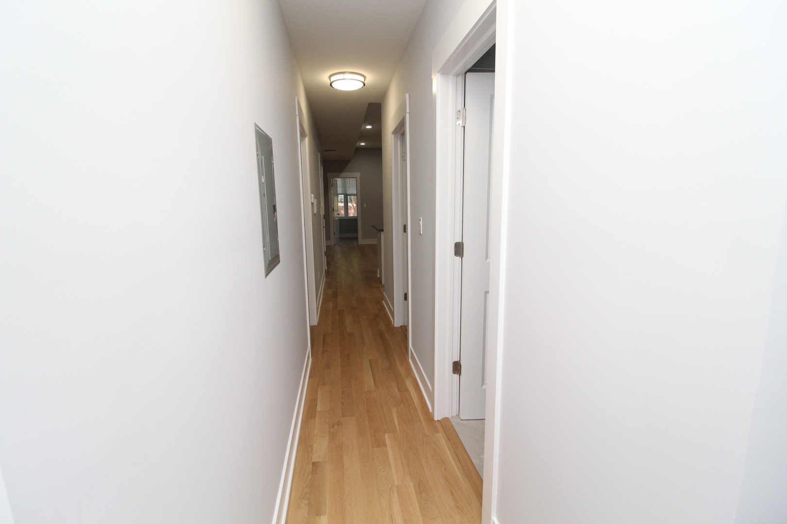 1411 West Taylor Street, Unit 2F Chicago, IL 60607 - Photo 12 of 12 a view of a hallway with wooden floor