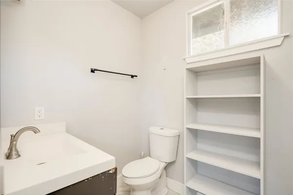 a bathroom with a sink and a toilet