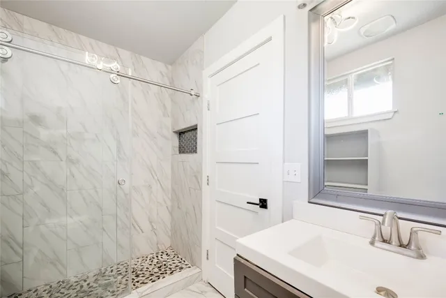 a bathroom with a sink and a mirror