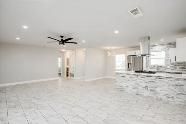 a view of a kitchen and a window