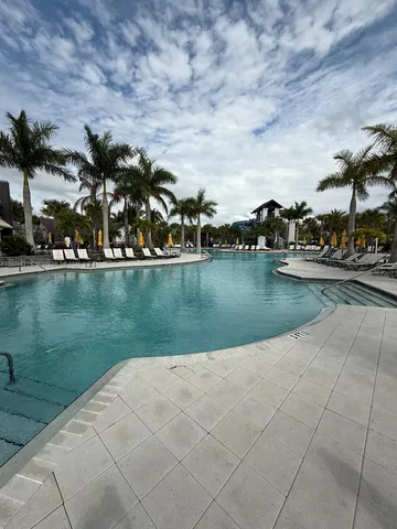 an aerial view of a house with a lake view