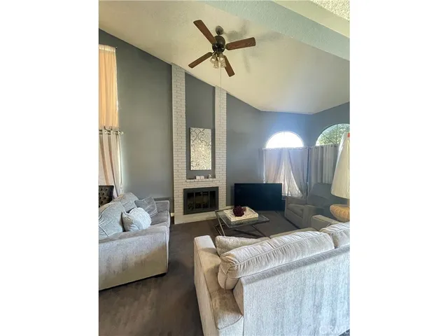 a living room with furniture and a table