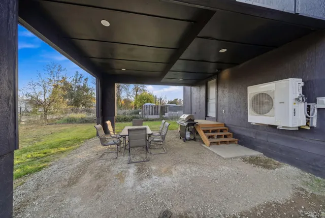 a view of an outdoor dining space with furniture