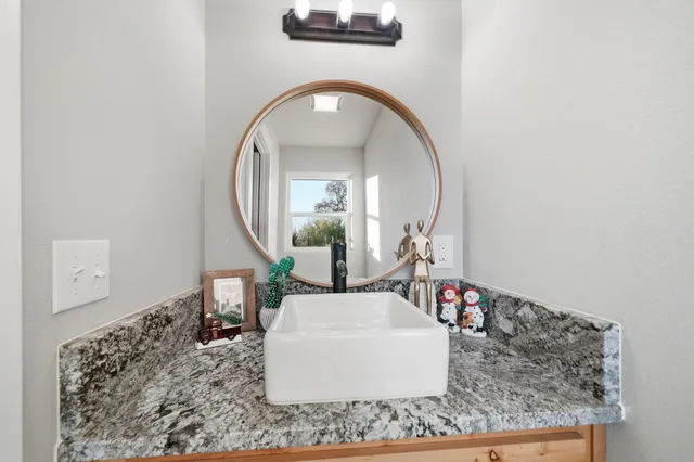 a bedroom with furniture and a window