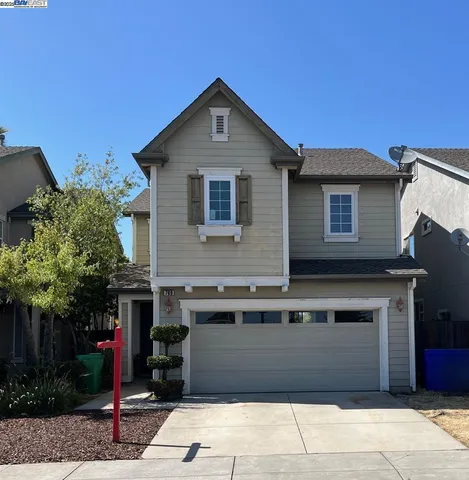 a front view of a house with a garage