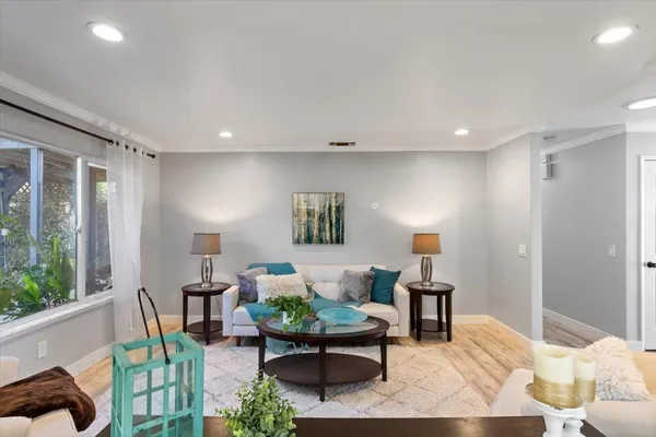 a living room with furniture and a table