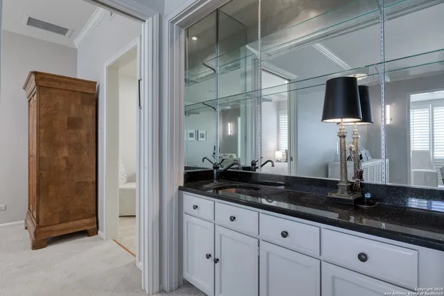 a kitchen with stainless steel appliances kitchen island granite countertop a refrigerator and a stove top oven