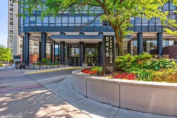 front view of a building with potted plants