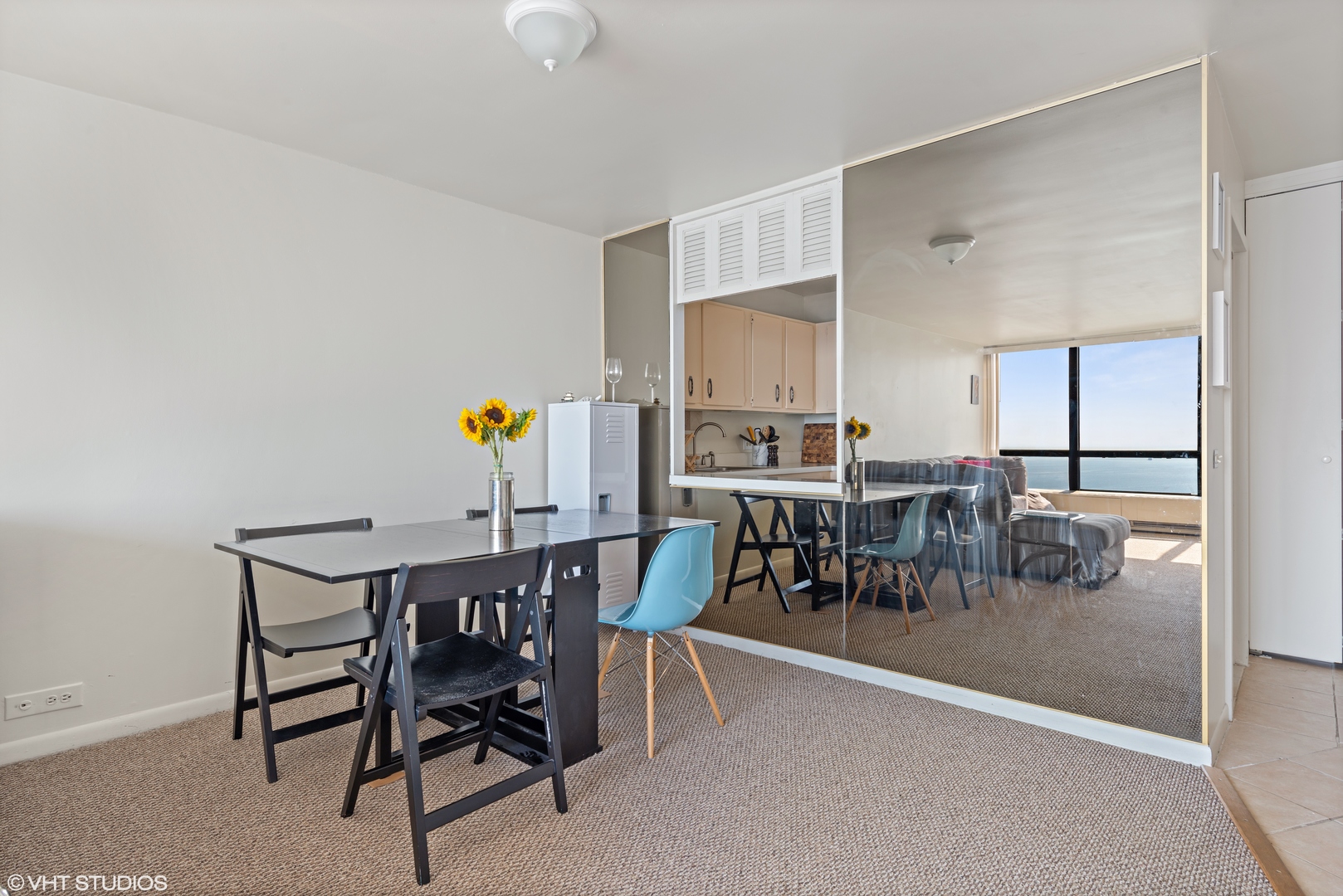 5415 North Sheridan Road, Unit 5305 Chicago, IL 60640 - Photo 7 of 16 a view of a dining room with furniture